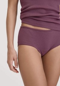Purple cotton brief with a smooth texture and elastic waistband, paired with a matching tank top, displaying a fitted design.