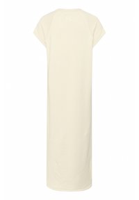 Rochie lungă de culoare crem, cu mâneci scurte tip raglan și guler rotund. Confecționată dintr-un material moale, are un design cu tăietură dreaptă.