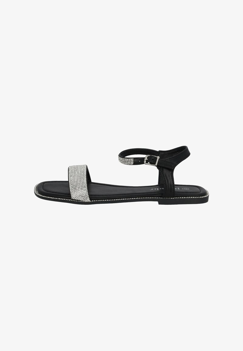Black sandal with a flat sole, featuring a rhinestone-embellished strap, adjustable ankle strap, and smooth leather upper.
