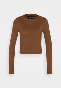 Brązowy, długi rękaw, krótki top wykonany z miękkiego materiału. Posiada okrągły dekolt i prążkowaną fakturę. Etykieta markowa wewnątrz kołnierza.