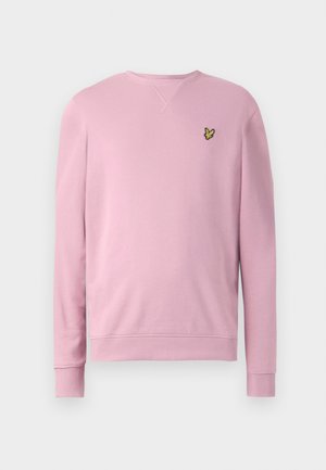 Gaiši rozā garu piedurkņu kreklis ar apaļu kakla izgriezumu, ar ribotām aprocēm un apakšmalu, uz kreisā krūšu laukuma ir neliels dzeltenas putna logo.