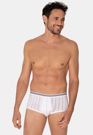 Sous-vêtements en coton blanc avec des rayures verticales bleu marine et une ceinture rayée noir et blanc, offrant un ajustement serré et une texture lisse.