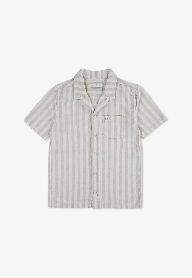 Πουκάμισο με κοντά μανίκια και κουμπιά, κατασκευασμένο από υφασμένο ύφασμα με κάθετες ρίγες σε μπεζ και λευκό. Διαθέτει τσέπη στο στήθος και γιακά με σχισμή.