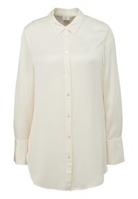 Blouse à manches longues couleur crème avec col pointu et fermeture boutonnée devant, réalisée en tissu lisse et léger.