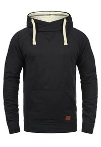 Black hoodie with a drawstring hood, a front pocket, ribbed cuffs, and hem. Features a textured finish and a small leather label on the front.