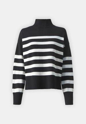 Pull rayé noir et blanc avec un col haut, des manches longues et un design court. Présente une texture côtelée le long de l'ourlet et des poignets.