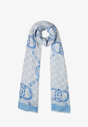 Sciarpa azzurro chiaro con un design geometrico arricchito da accenti blu scuro, tessuto testurizzato e bordi frangiati. I motivi includono cerchi e diamanti.