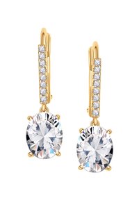 Złote kolczyki wiszące z dużymi owalnymi, przezroczystymi kryształami, ozdobione mniejszymi, przezroczystymi kamieniami w górnej części. Klasyczny design.