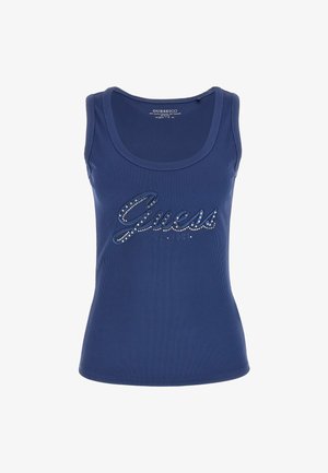 Sininen ribattuja hihaton paita, jossa on pyöreä kaula-aukko ja tiukka siluetti, etupuolella on kristallikoristeltu "Guess"-logo.