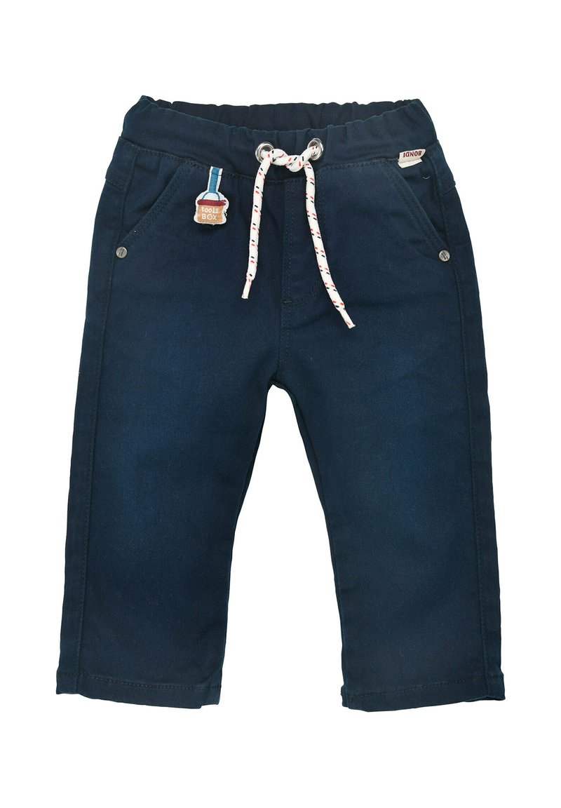 Marineblaue Jeanshose mit einem Kordelzugbund, Fronttaschen und einem dekorativen patch auf der linken Tasche.