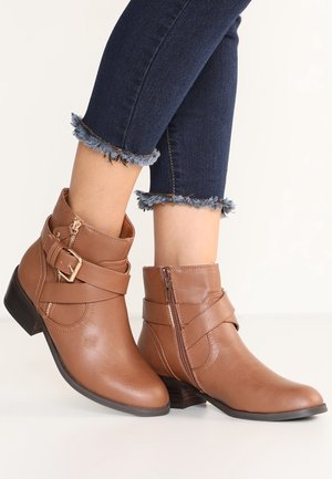 Botki kowbojki i motocyklowe