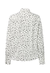 Langsleeve knoopshirt in lichtroom met een verspreid bloemenpatroon in zwart en blauw. Bevat een klassieke kraag en een gebogen zoom.