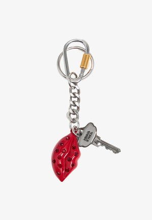 Red glossy keychain shaped like a teardrop with rhinestones, attached to a silver chain and key with a rounded head and jagged blade.