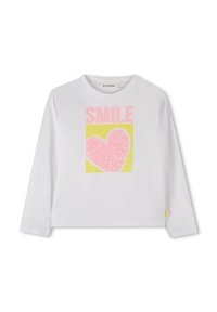 Weißes Langarmhemd mit einem bunten "SMILE"-Grafik und einem pinken Herz auf gelbem Hintergrund. Hergestellt aus weichem Baumwollmaterial.