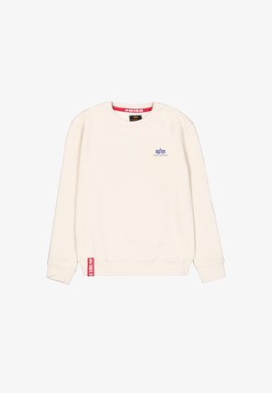 Kremfarget hettegenser laget av mykt stoff. Har en blå logo på brystet og en rød etikett nederst til venstre. Klassisk design med rund hals.