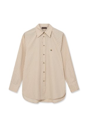 Beige long-sleeve button-up shirt with black vertical pinstripes, pointed collar, and small embroidered flower detail on the left chest.