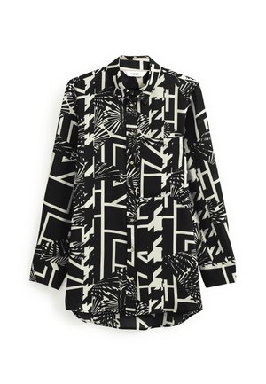 Long-sleeve button-up shirt with black and white geometric and abstract palm leaf patterns, collar, and front chest pocket.