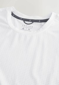 White active t-shirt with a textured pattern, round neckline, and gray contrasting inner collar. Features "ACTIVE AIM" label beneath collar.