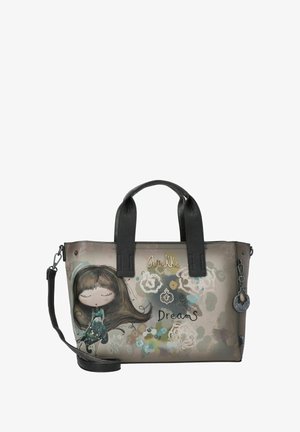 Zwarte handtas met leren handvat, versierd met een kleurrijke illustratie van een meisje en een bloemenmotief. Voorzien van een afneembare schouderband en een sleutelhanger met een charm.
