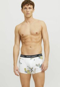 Herren Boxershorts mit weißem Grund und mehrfarbigen Blumenmustern. Schwarzer elastischer Bund mit "JACK & JONES"-Branding. Aus Baumwollmaterial.