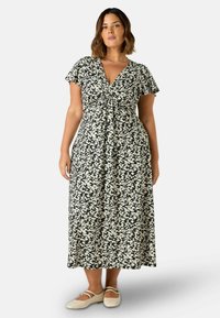 Maxi sukienka w kolorze czarnym z białym kwiatowym wzorem, z dekoltem w kształcie litery V, krótkimi falbankowymi rękawami i marszczeniem z przodu.