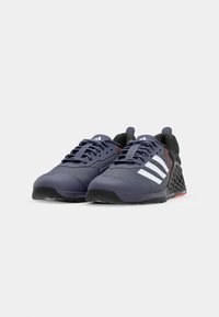 Navy mesh athletic shoes with white stripes, molded heel, and textured sole. Features a reinforced toe and contrasting red accents.