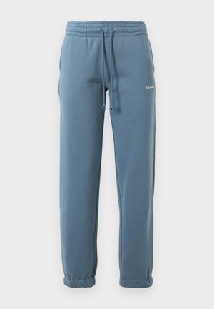 REGULAR - Tracksuit bottoms - blue