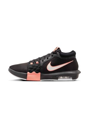 Black and coral Nike mid-top sneaker with mesh upper, visible air sole, and coral swoosh logo on the side.