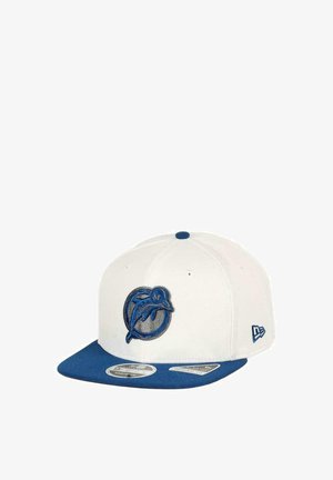 White baseball cap with a blue flat visor, featuring a blue embroidered dolphin logo on the front and New Era branding on the side.