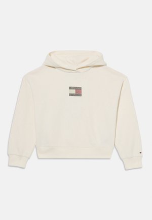 Felpa crema realizzata in tessuto morbido, con un logo grafico quadrato in nero e colori sul petto, dotata di polsini e orlo a costine.