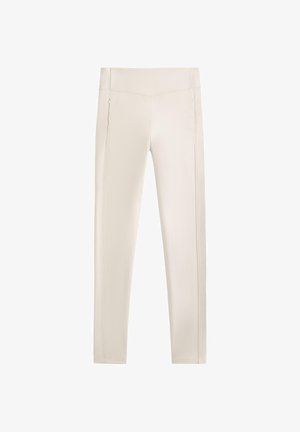 Pantaloni elasticizzati beige con una vestibilità slim, dotati di tasche laterali con zip e linee cucite lungo le cuciture per un tocco di dettaglio.