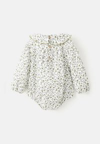 Biely kvetinový detský overal s zelenými akcentmi, nariasenými manžetami, riaseným golierom a drevenými gombíkmi na prednej strane. Celoplošný listový vzor.