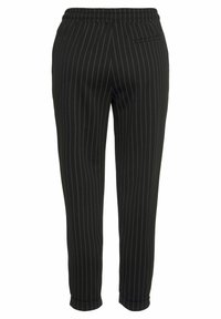 Pantalons noirs à rayures avec une taille élastique, forme cintrée, longueur cheville et une seule poche arrière. Texture de tissu douce.