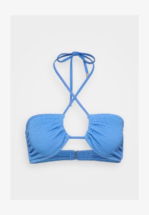 Blue bikini top featuring textured fabric, adjustable halter straps, and a back clasp closure. Designed with an open center for minimal coverage.