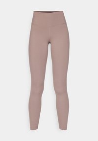Leggings de cintura alta en un color malva suave, fabricados con una tela lisa y elástica. Cuentan con un diseño sin costuras y sin elementos metálicos destacados.