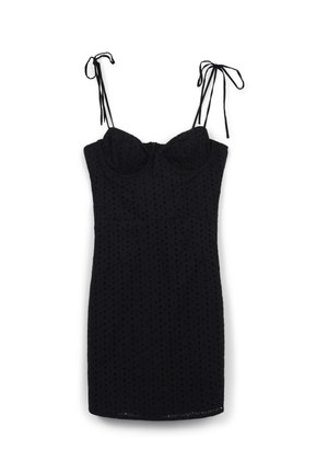 Vestito mini senza maniche di colore nero con spalline da annodare e un motivo a pois texturizzato, busto aderente e orlo dritto.