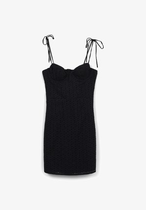 Vestito mini senza maniche di colore nero con spalline da annodare e un motivo a pois texturizzato, busto aderente e orlo dritto.