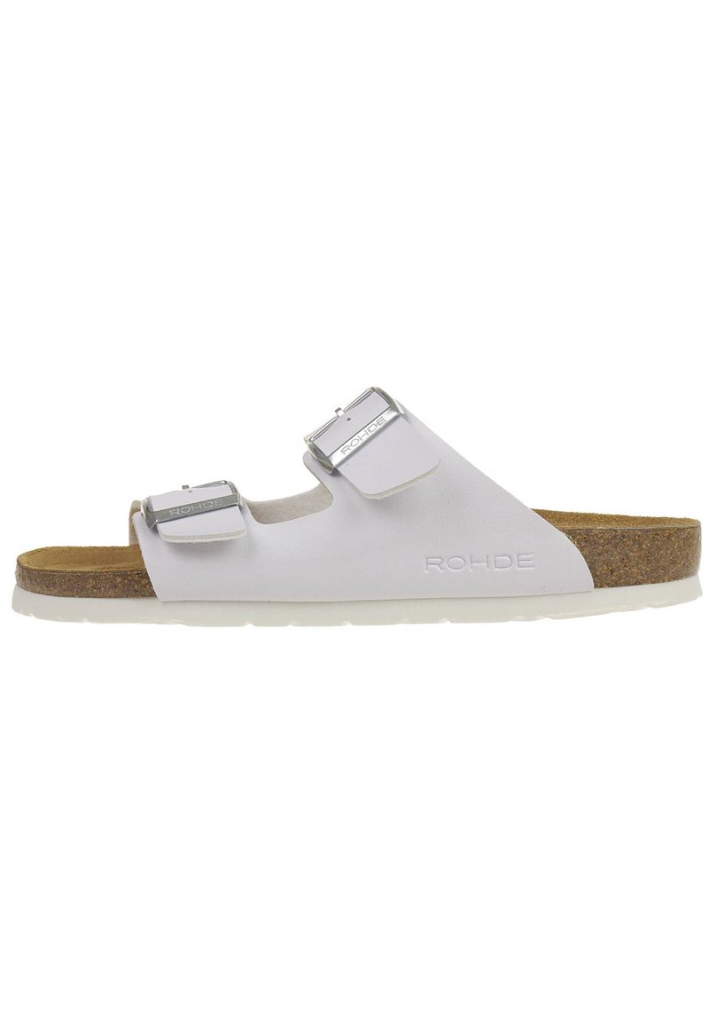 White slide sandal with two adjustable metallic buckles, cork footbed, and rubber outsole. Features embossed logo on the side.