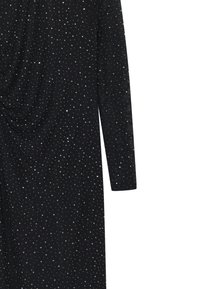 Mustakteri pikkade varrukatega, mis on varustatud drapeeritud esiosa ja laiali puistatud hõbedaste sädelevate kivikeste, luues tekstuurse, tähtede sarnase mustri.