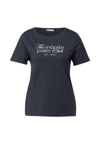 T-shirt en coton bleu marine à manches courtes, col rond, avec le texte blanc "The Infinite Palm Club EST. 2025" sur le devant.