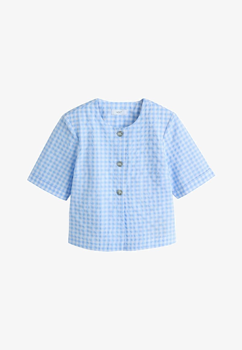 Haut à manches courtes en tissu léger vichy bleu, avec trois boutons sur le devant et un col rond.