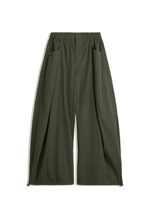Wide-leg trousers in olive green fabric, featuring an elastic waistband, two side pockets, and a textured finish.