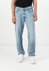 Light blue denim straight-leg jeans with a classic five-pocket design, subtle fading, and a button closure at the waistband.