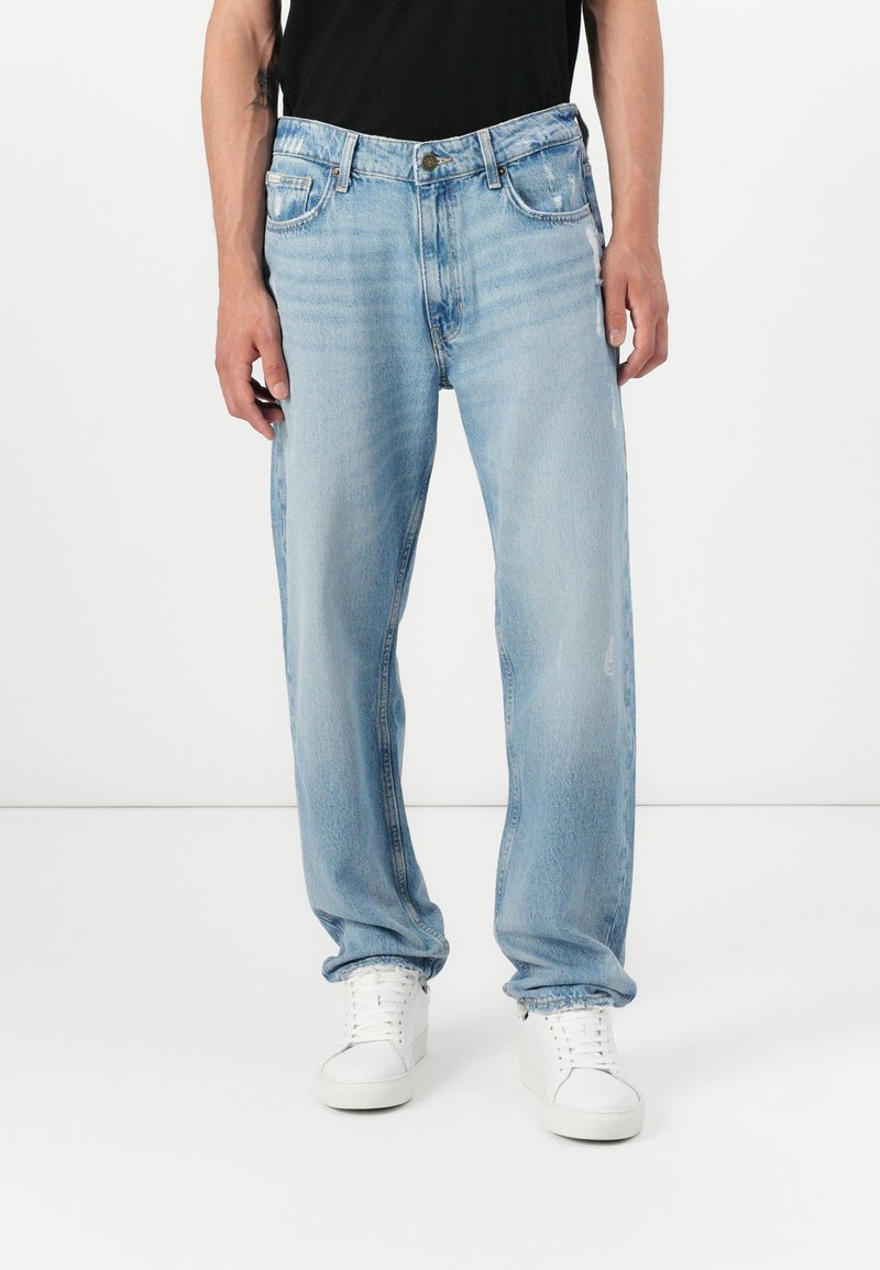 Light blue denim straight-leg jeans with a classic five-pocket design, subtle fading, and a button closure at the waistband.