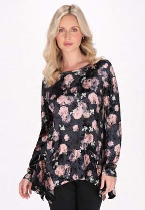 Black floral tunic with long sleeves, featuring a soft, textured fabric adorned with pink and white flowers, and a flowy hemline.
