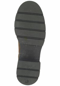 Schwarze Gummisohle mit strukturiertem Grip, horizontalen Rillen und runden Details. Mit der Kennzeichnung "37" und "camel active"-Marke an der Ferse.