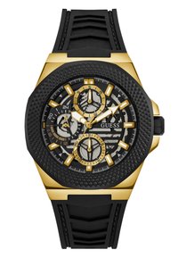 Montre chronographe noire et dorée avec un bracelet en caoutchouc noir texturé, boîtier octagonal et sous-cadrans chronographes affichant des motifs détaillés.