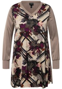 Kwiatowa tunika z dekoltem w serek, w odcieniach beżu i fioletu, z długimi rękawami i strukturalnymi mankietami. Lekki materiał z abstrakcyjnymi wzorami.