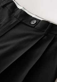 REGULAR FIT - TAILORED CULOTTES  . - Housut - black