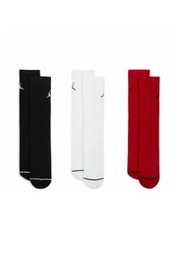 Tre paia di calzini al ginocchio: nero, bianco e rosso. Ogni paio presenta una texture a coste e un piccolo logo nero sul lato.